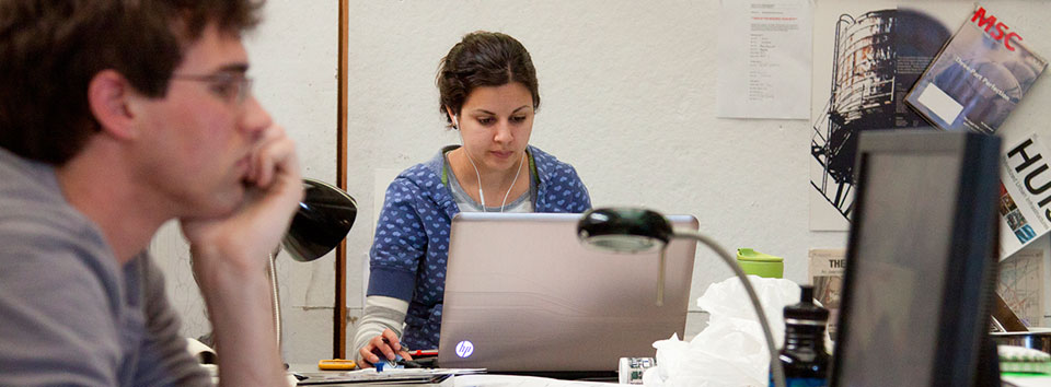 two students using computers in a computer lab