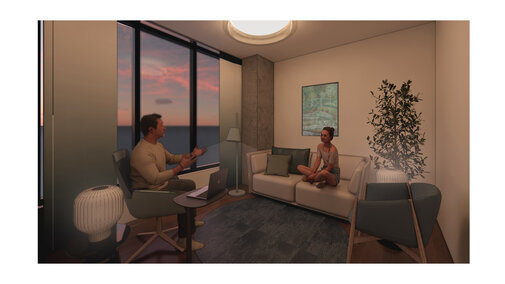 Cozy modern room at sunset, two people talking, one seated on a sofa, the other in an armchair.