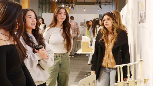 students talking about another student's architecture project