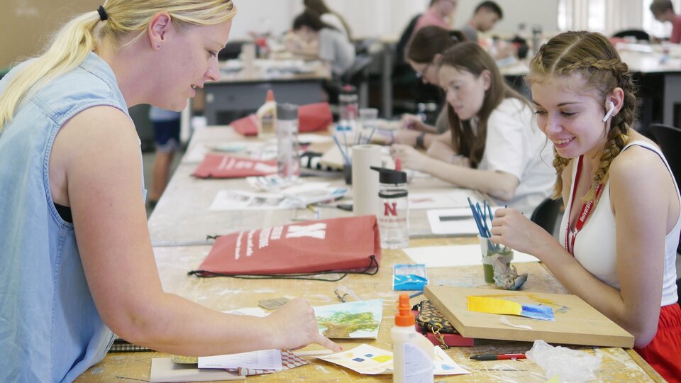 a teacher helping her student