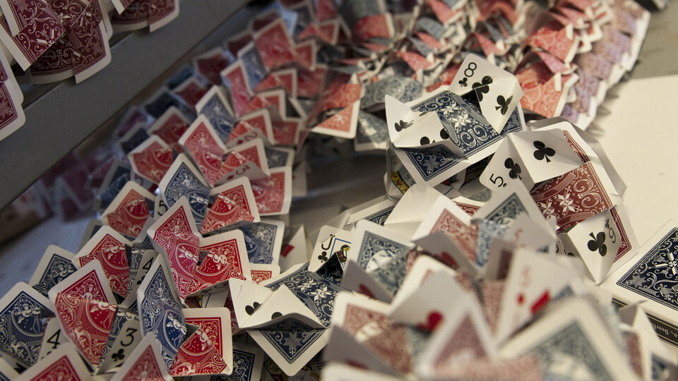 playing cards folded and placed on top of each other