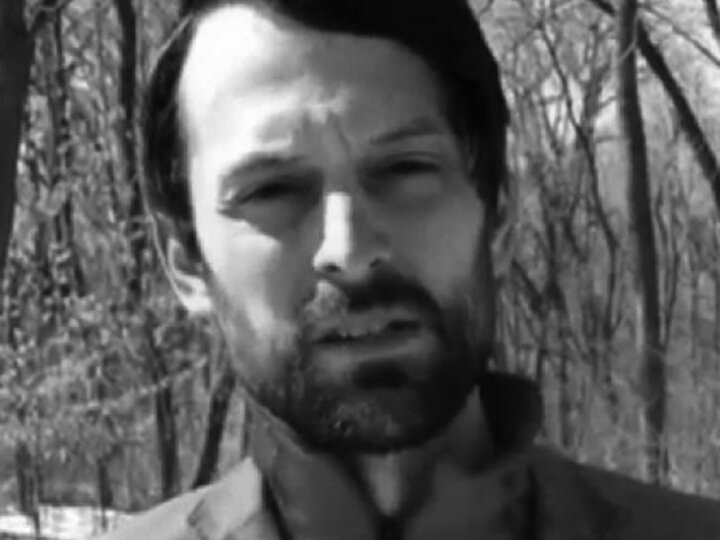 black and grey headshot of a symposium speaker