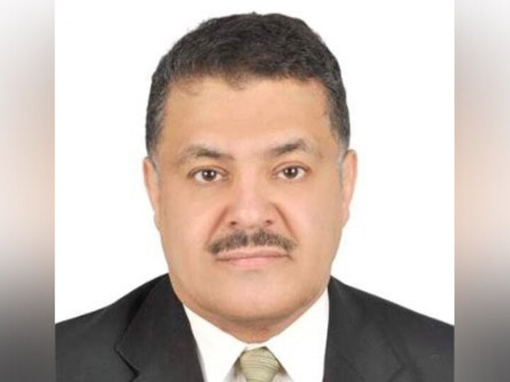 headshot of a individual in a suit