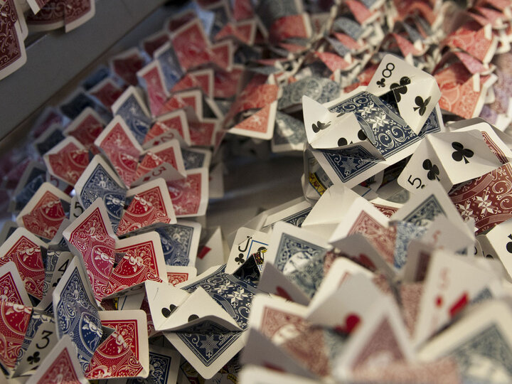 playing cards folded and placed on top of each other